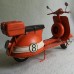 Oranje Vespa scooter blik - vintage